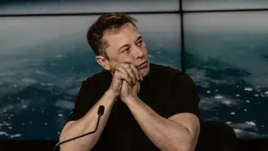 Elon_Musk_at_a_Press_Conference.webp